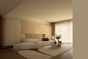 Cozy bedroom with a wooden floor, a bed, a table, and a vase, decorated in a white color scheme