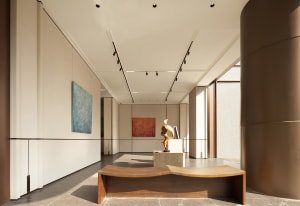 A large, open room with a wooden floor, featuring three paintings on the walls and a sculpture on a pedestal, in a contemporary style with a focus on art pieces and open layout