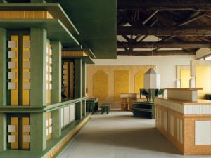 A modern living and dining space with a wooden floor, yellow walls, and a variety of furniture including a dining table, chairs, and a couch, arranged to create a comfortable and inviting atmosphere