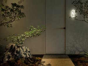 A dimly lit room with a white door and a rock in front of it, creating a cozy atmosphere
