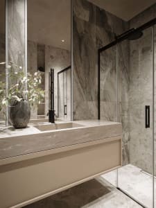 Modern bathroom with a marble countertop, sink, shower, and potted plant, under a mirror, with a luxurious and high-end design