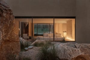 A well-lit, modern interior space with a large window, clean lines, and minimalistic design elements