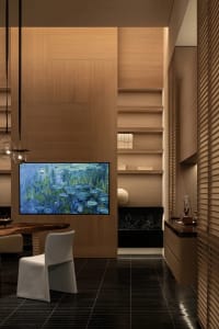 A modern living room with a dining table, couch, and various furniture pieces, well-lit and inviting