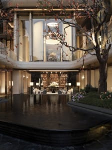 Bright and inviting office space with glass facade, atrium, and modern furniture