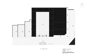 Black and white floor plan of a large room with furniture and linework indicating room dimensions and layout