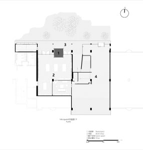Black and white floor plan of a modern building with multiple rooms, including a living room, dining room, and kitchen, featuring clean lines and minimal decoration