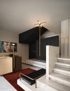A modern living space with a marble staircase, a TV, and a couch, set in a dimly lit room with a cozy atmosphere