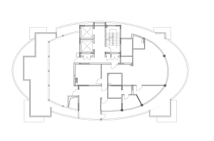 Black and white architectural floor plan of a large oval-shaped luxury home with multiple bedrooms, living areas, and curved exterior walls.