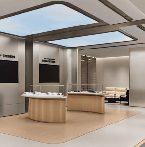 Modern luxury retail interior with curved light-oak display counters, beige walls, large skylight ceiling, and a seating area in the background.