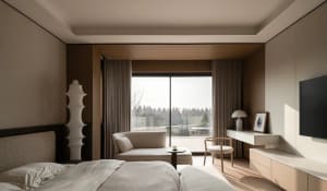 Modern minimalist bedroom interior with beige bedding, wood paneling, large panoramic window with forest view, chaise lounge, and floating desk.
