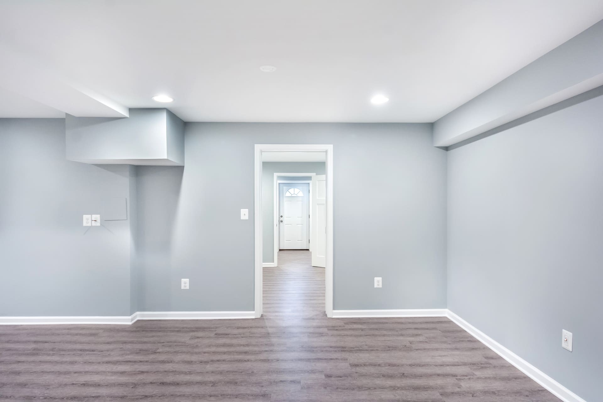 Compact Seattle basement upgraded with bright lighting and storage.