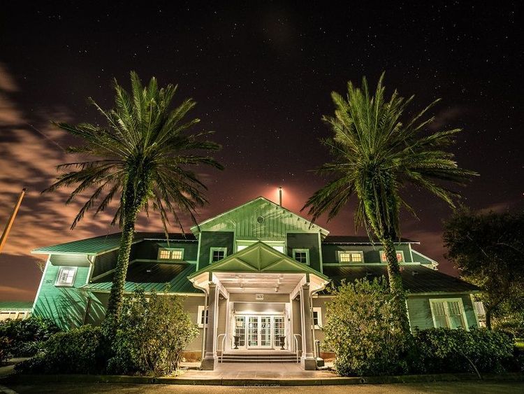 Signature FBO at North Palm Beach County General Aviation Airport entrance with palm trees