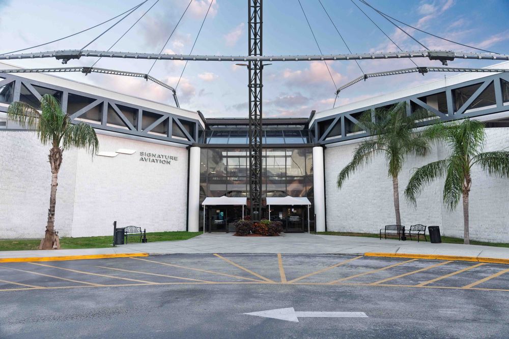 Signature TPA FBO guest entrance with palm trees