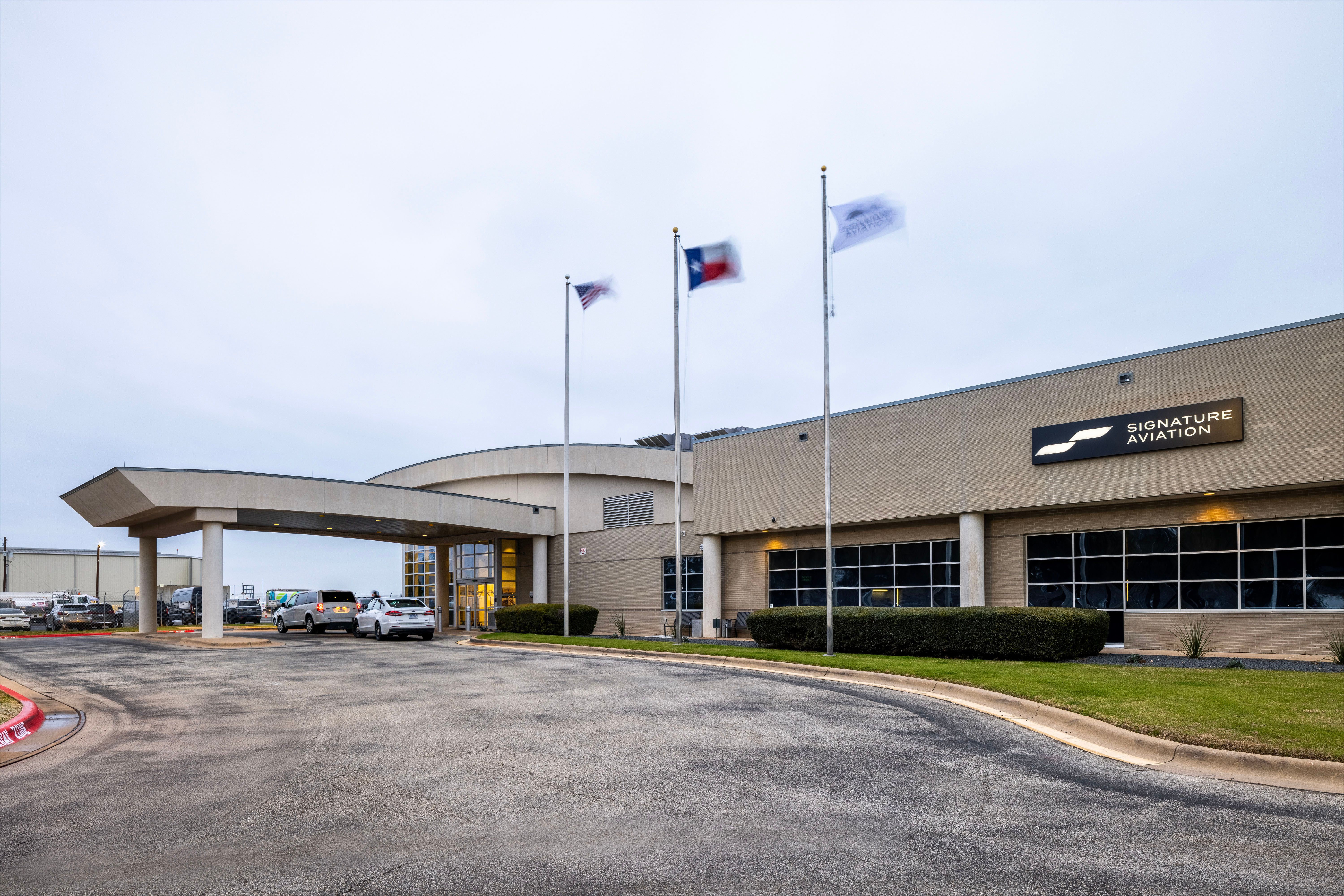 Main entrance and terminal building at Signature Aviation AUS, offering ground handling and business aviation services for operators traveling to Austin for Formula 1 events.