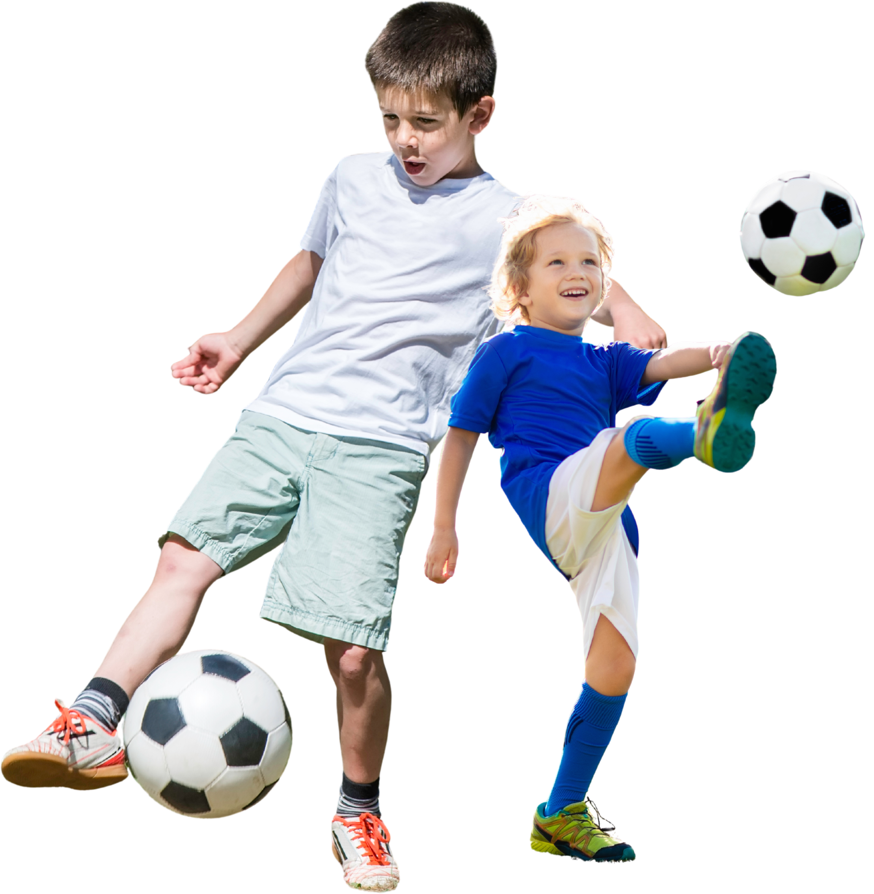 Youth players kicking a football