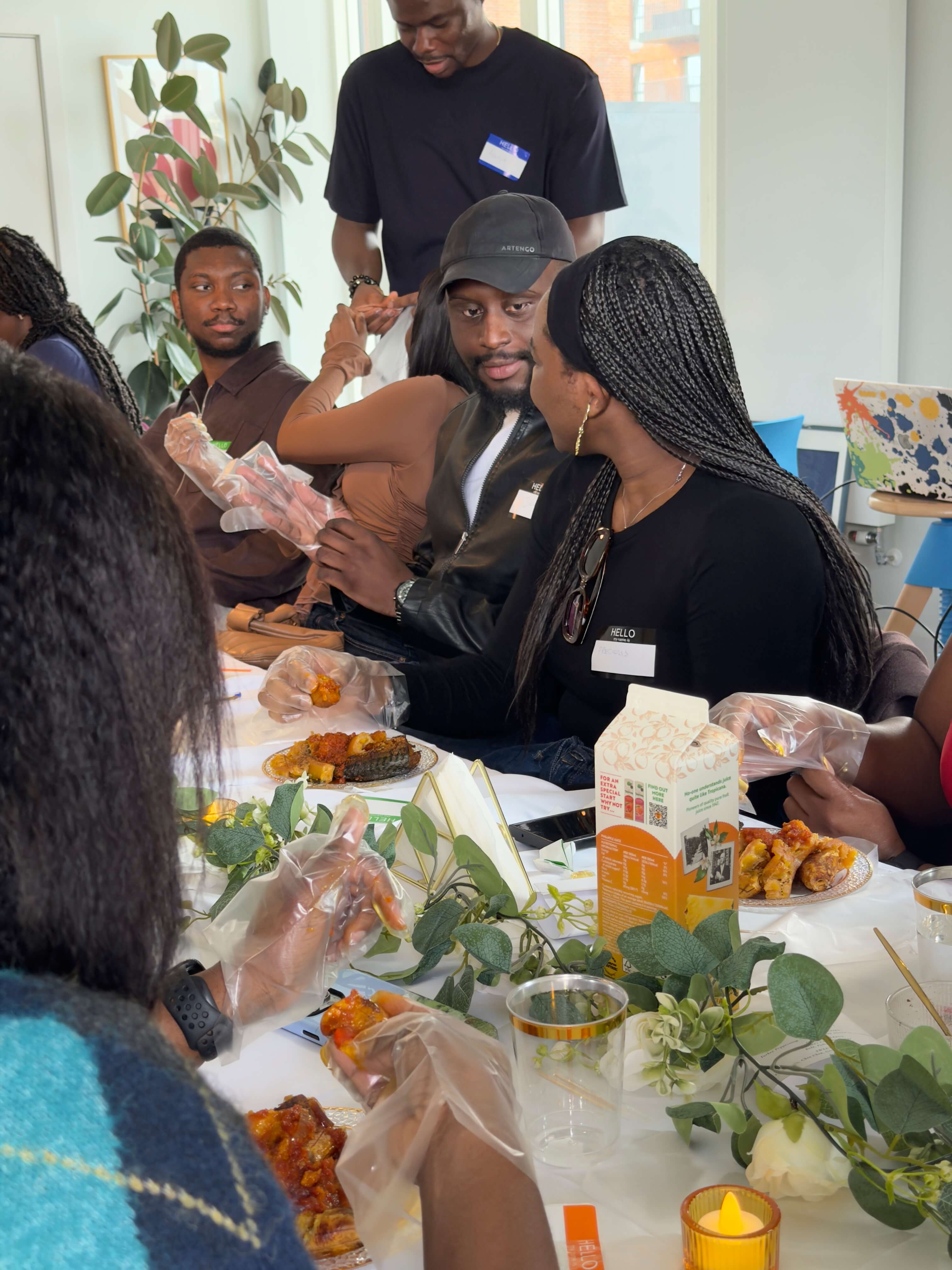 Guests eating and playing a live Neegma game at Wajeun's Eat and Play event