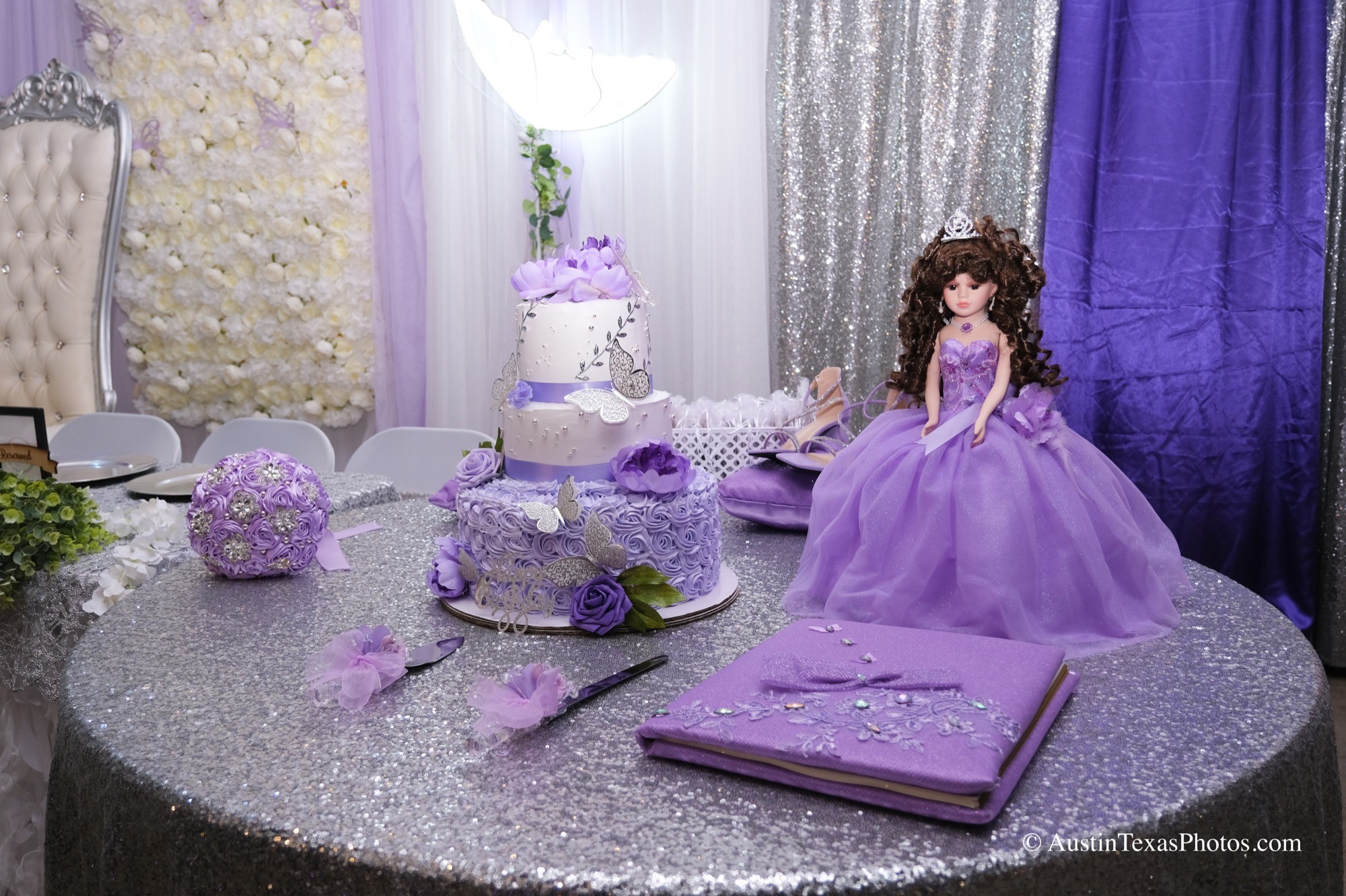 Quinceañera cake, doll, and invitation book detail