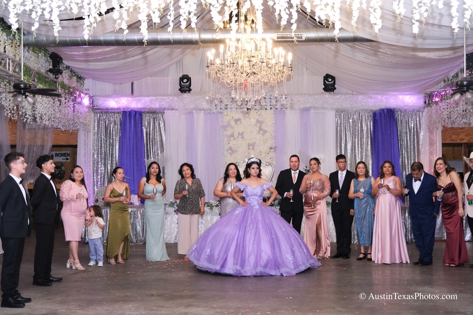 Quinceañera toast with everyone gathered in the picture