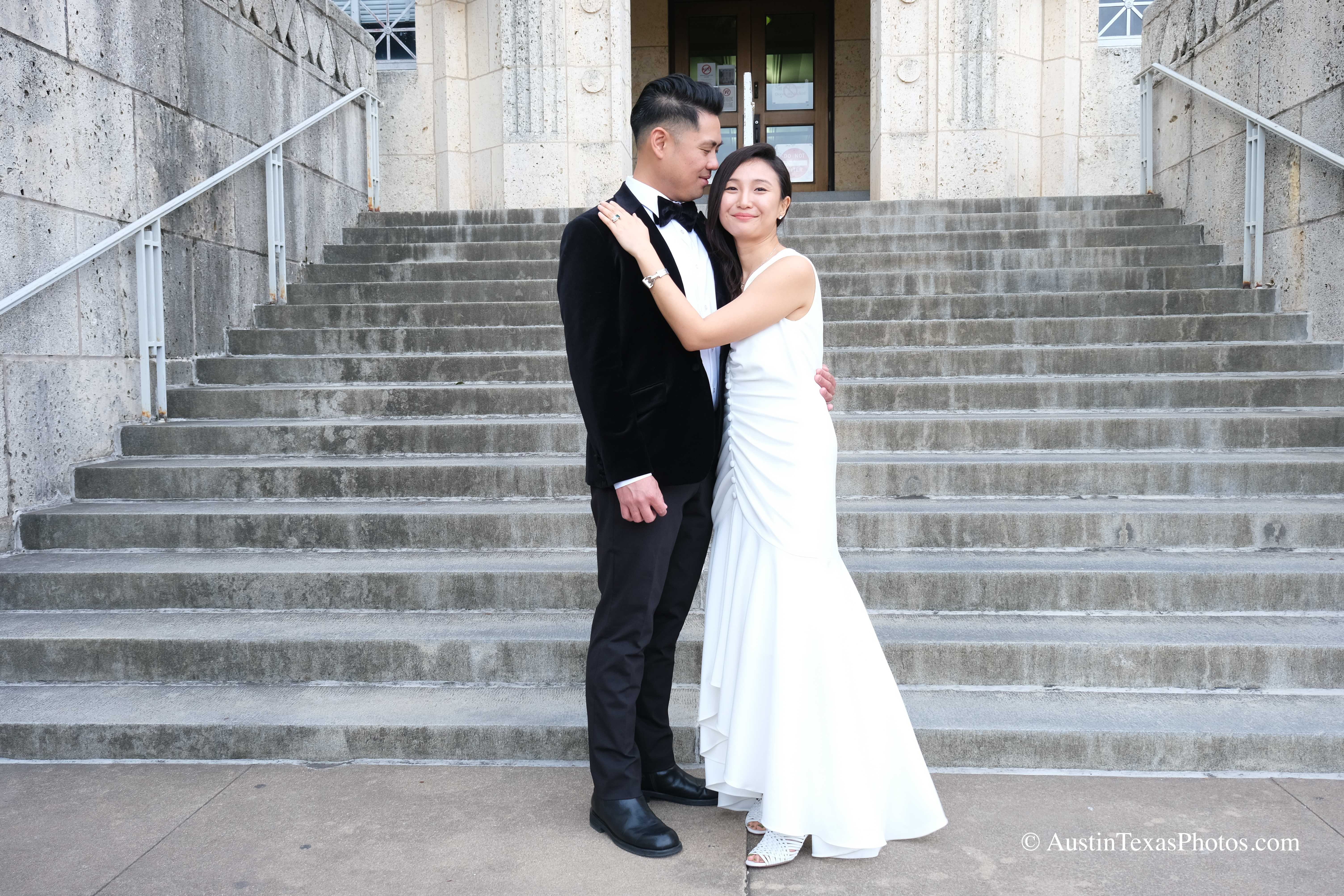 Bride and groom on the Texas State Capitol stairs, groom gazing at bride, Austin, Texas
