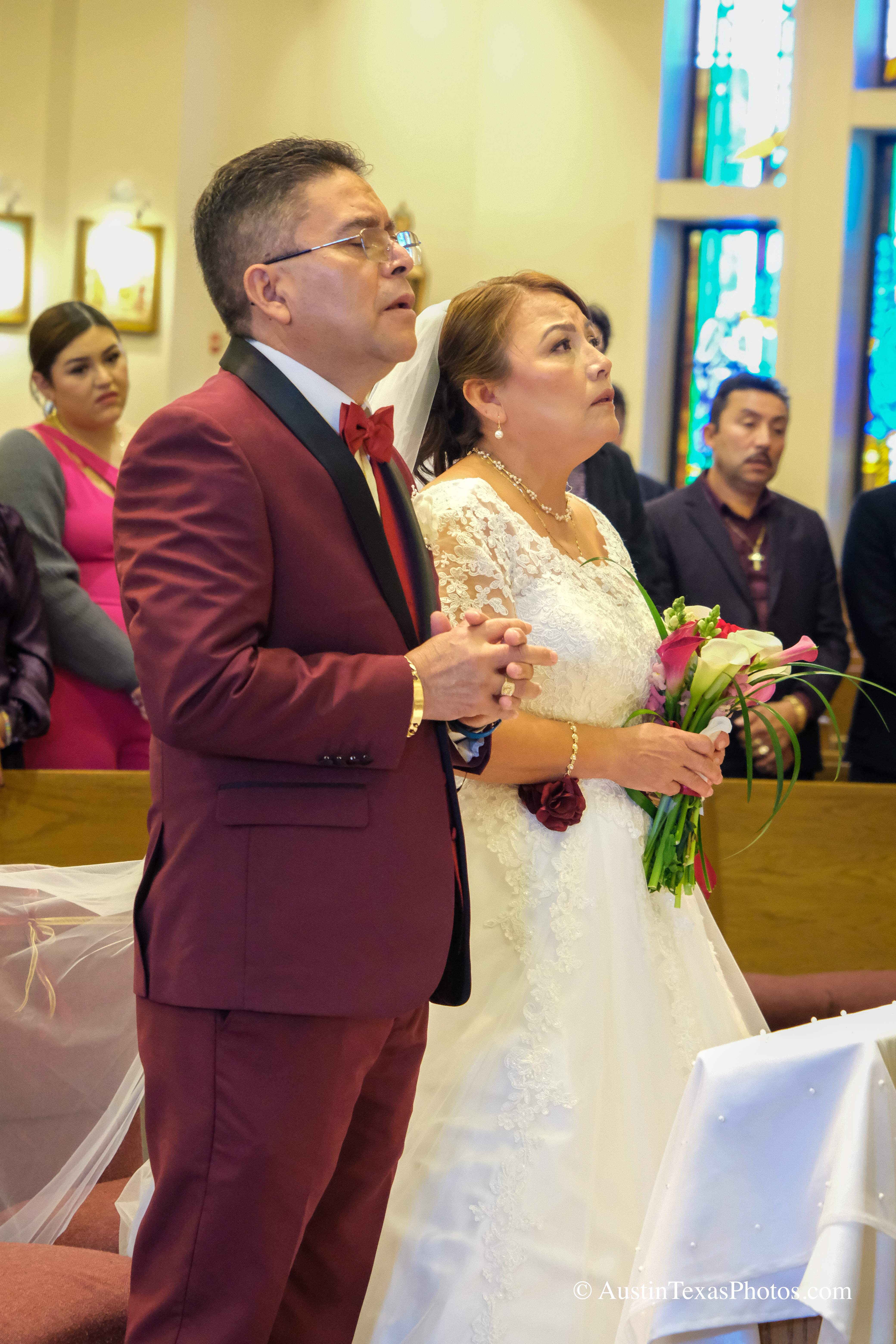 Bride and groom standing close at the altar during wedding ceremony