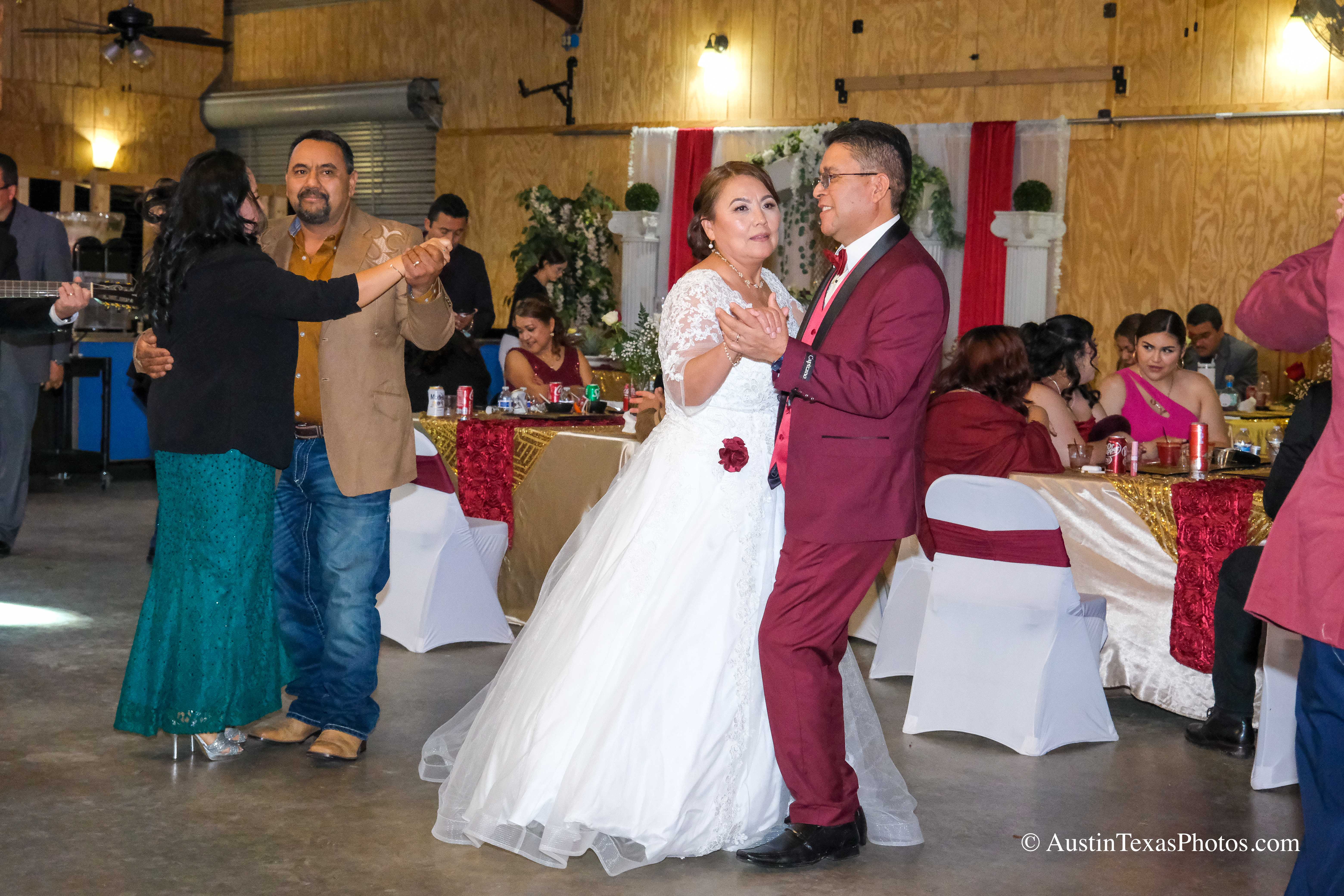 Bride and groom dancing together at wedding reception