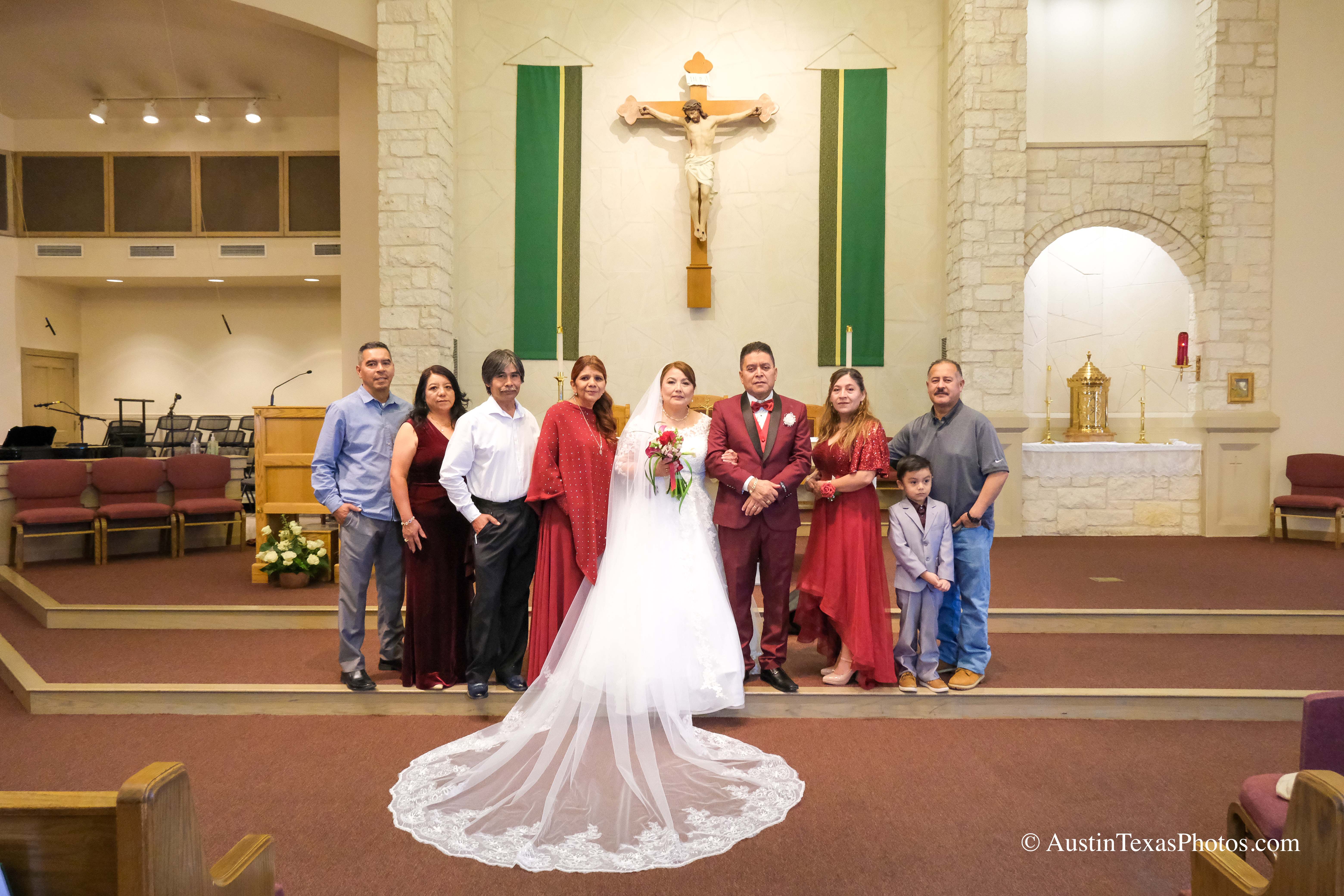 Multi-generation wedding family portrait at the altar