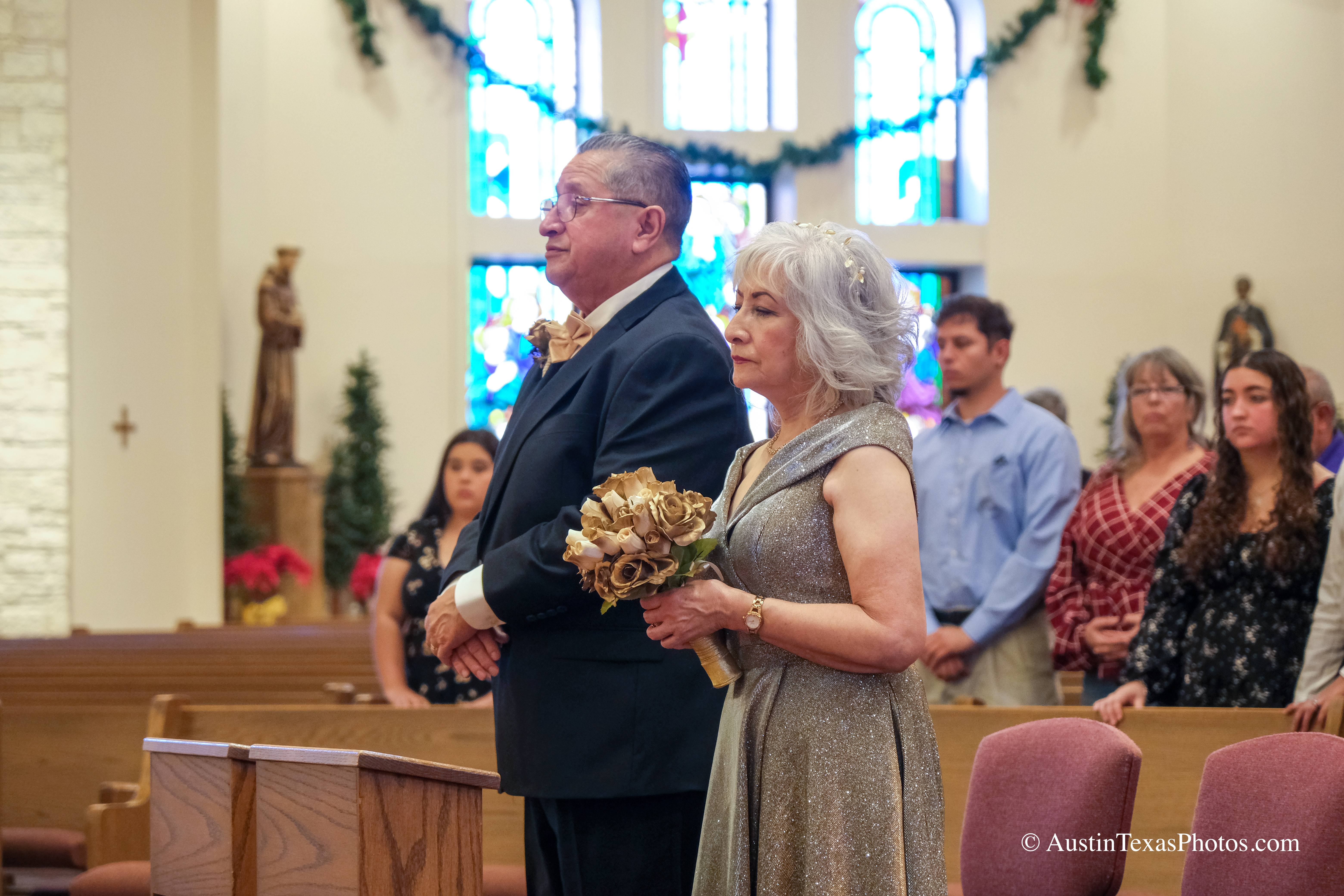 Bride and groom standing close together at the altar during wedding ceremony