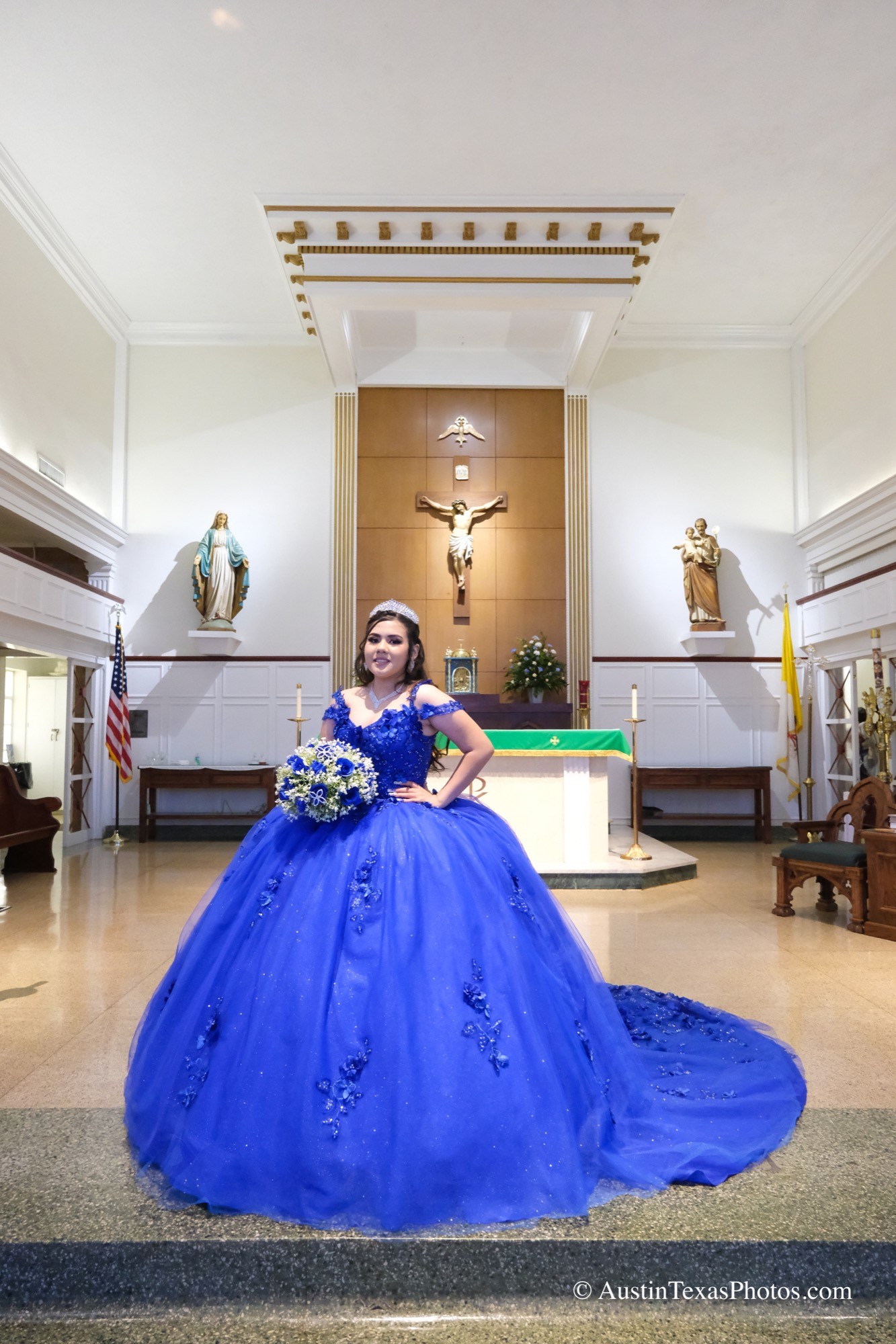 Quinceañera standing and posing at church in her gown