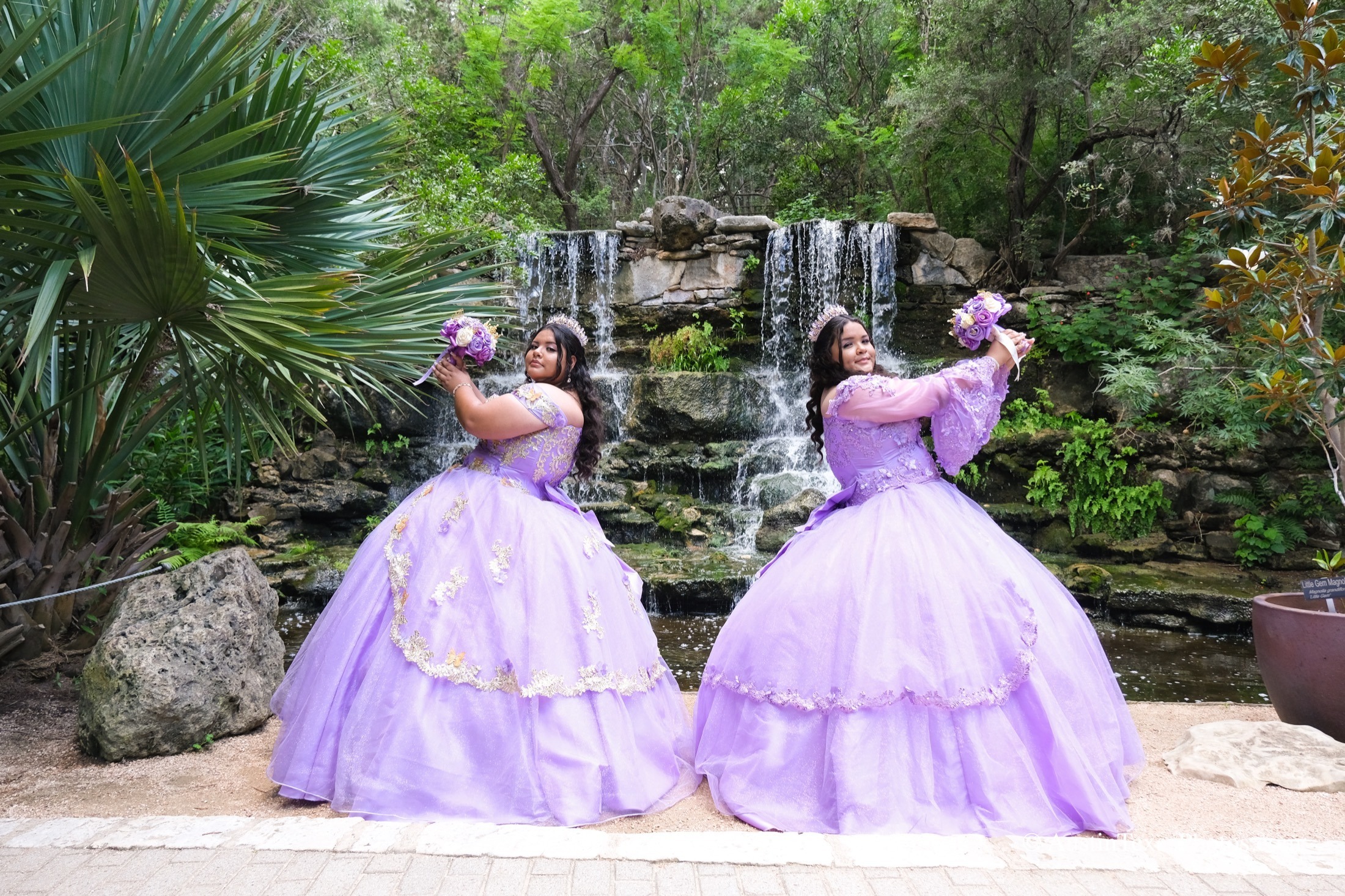 Quinceañera in a pink ball gown with tiara and bouquet