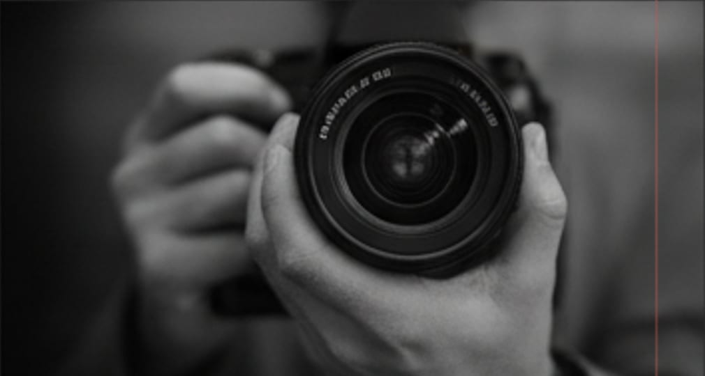 BEHIND THE LENS