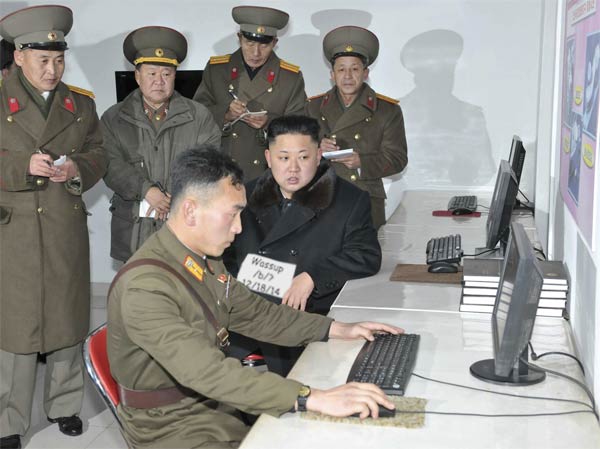 A North Korean soldier coding on a laptop, symbolizing focused and disciplined preparation.