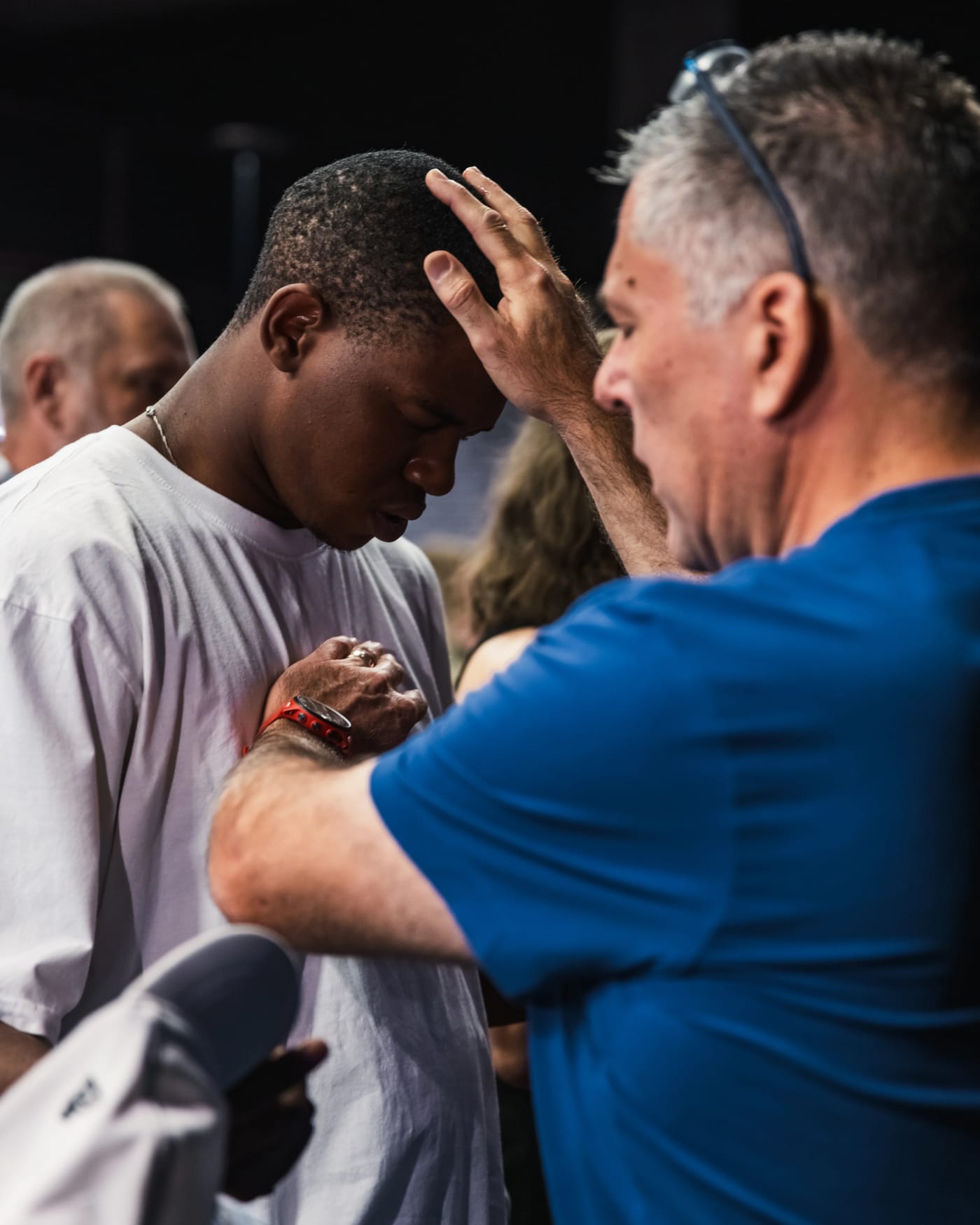 Graduate receiving prayer and impartation from leadership