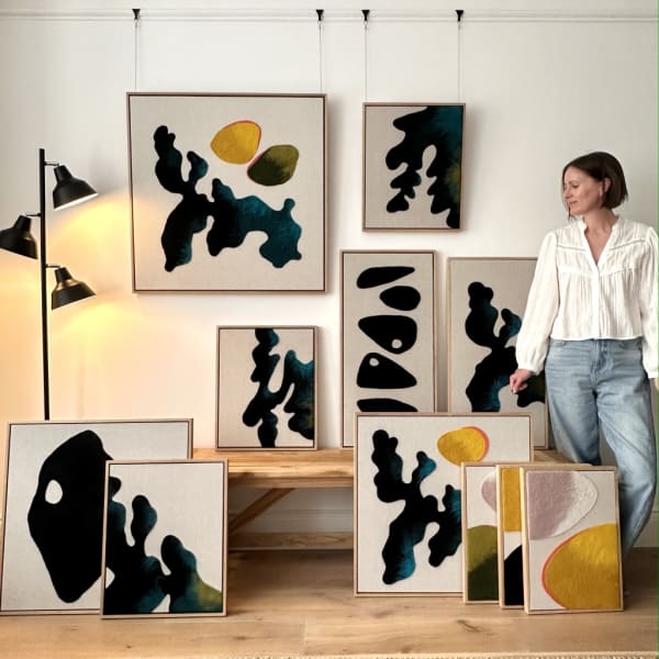 Dianne Randle with a collection of her Textile wall art