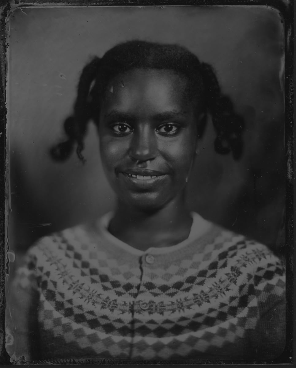 A studio portrait of a very self-possessed young woman.
