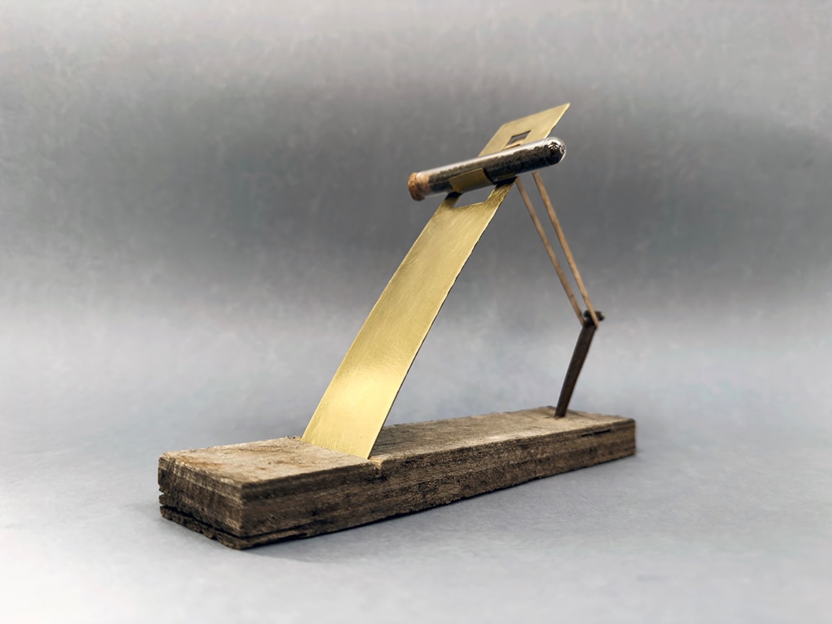 Project I. Brass, reclaimed plywood, 19th century nail, rubber band and test tube filled with Fenland soil. 21cm x 5.5cm x16.5cm approx.