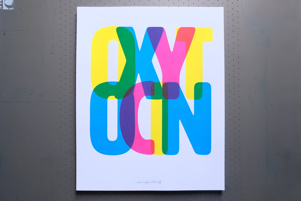 Bold letters, printed in cyan, magenta and yellow, snuggle up to each other, creating new colours.