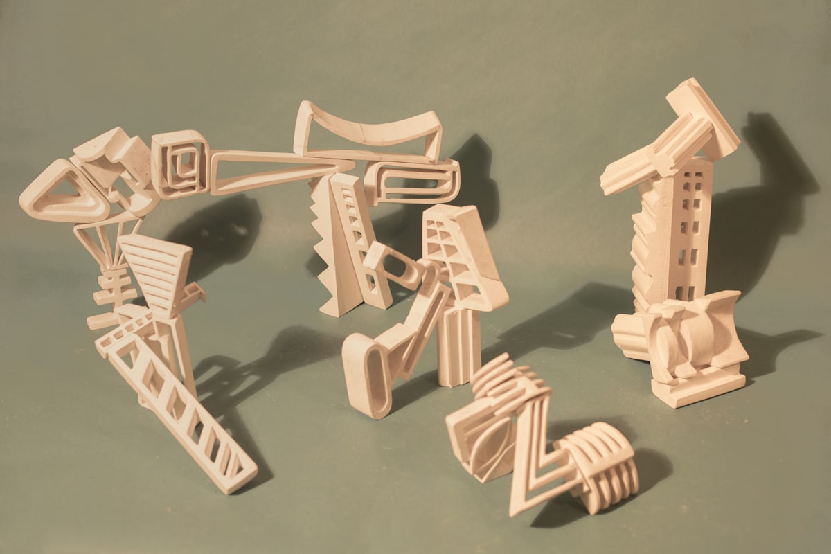 Carved plaster sculptures of abstract apparatus 