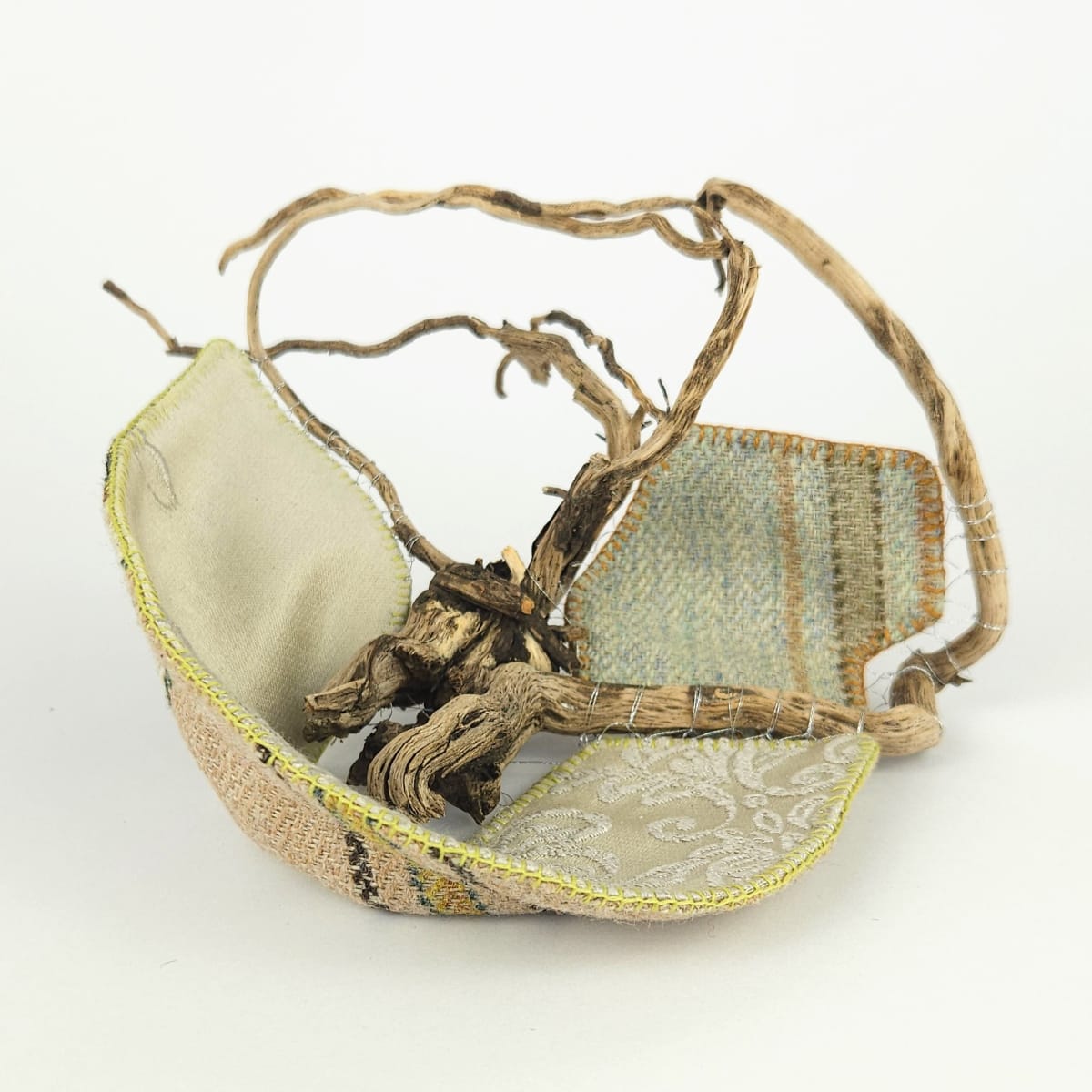 Saltmarsh Vessel. A bowl-like artefact. Organic matter and textile.