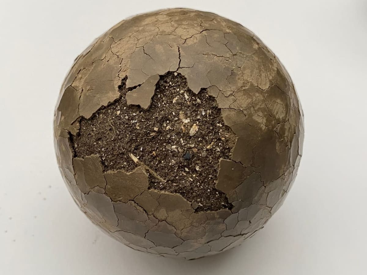 Dorodango — a wild-clay sphere cracked open to reveal its core — Angenita Teekens