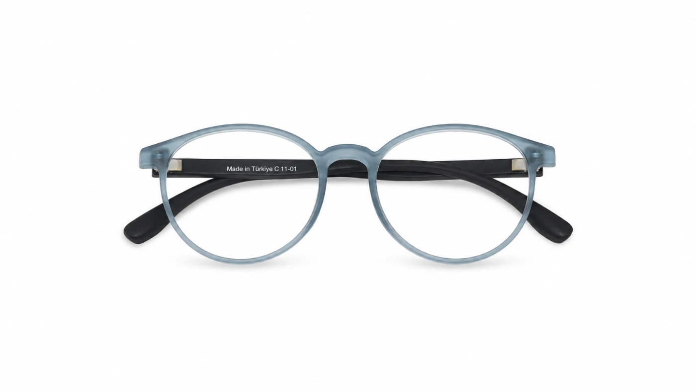 Ando Zomrod Kids eyeglasses with a round frame in transparent blue, made of TR90 material, Turkish made, lightweight, flexible and break-resistant, suitable for fitting medical lenses and daily use.