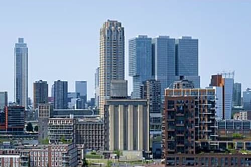 Manhattan skyline with Empire State Building and tall skyscrapers under clear blue sky