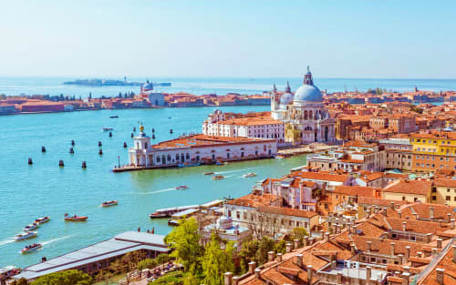 Aerial view of Venice, Italy showing the Basilica di Santa Maria della Salute, Grand Canal, and historic waterfront buildings