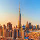 Burj Khalifa and Dubai skyline at sunset with surrounding skyscrapers and cityscape