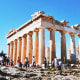 The Parthenon ancient Greek temple on the Acropolis in Athens with tourists visiting the iconic marble columns and ruins