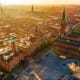 Aerial view of Copenhagen city center at golden hour with historic buildings and town square