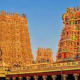 Meenakshi Temple in Madurai with ornate colorful gopurams against blue sky