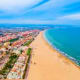 Aerial view of Malvarrosa Beach in Valencia, Spain with turquoise Mediterranean Sea and sandy shoreline