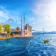 Ortakoy Mosque on the Bosphorus waterfront in Istanbul with suspension bridge in background