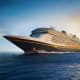 Modern cruise ship with black hull and gold trim sailing on blue ocean under clear sky