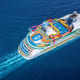 Aerial view of Navigator of the Seas cruise ship sailing on blue ocean waters with colorful deck attractions visible